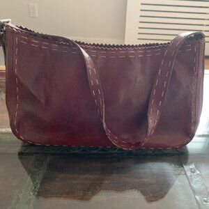 Red leather handbag